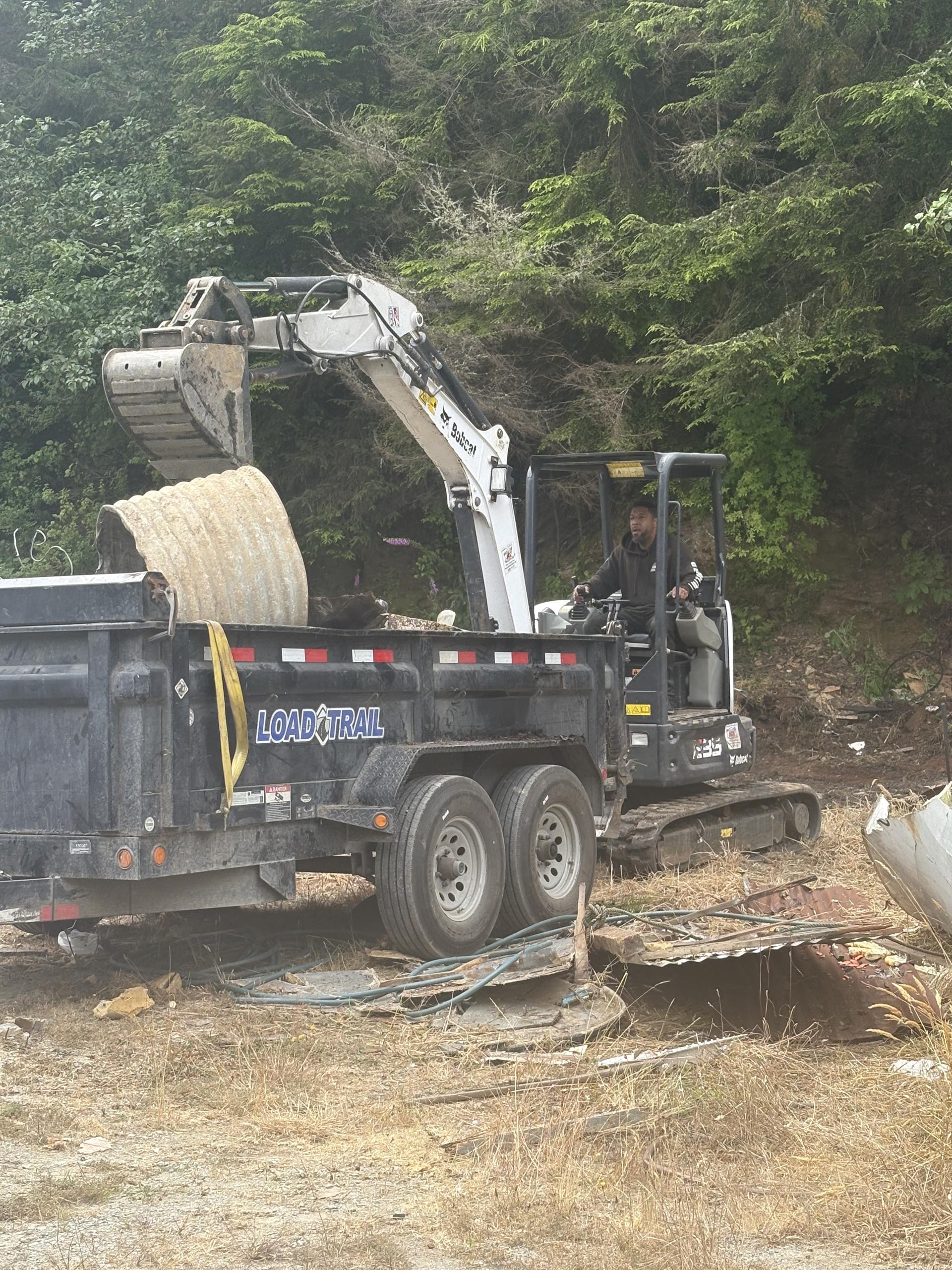 Crew dismantling a backyard shed in Redding