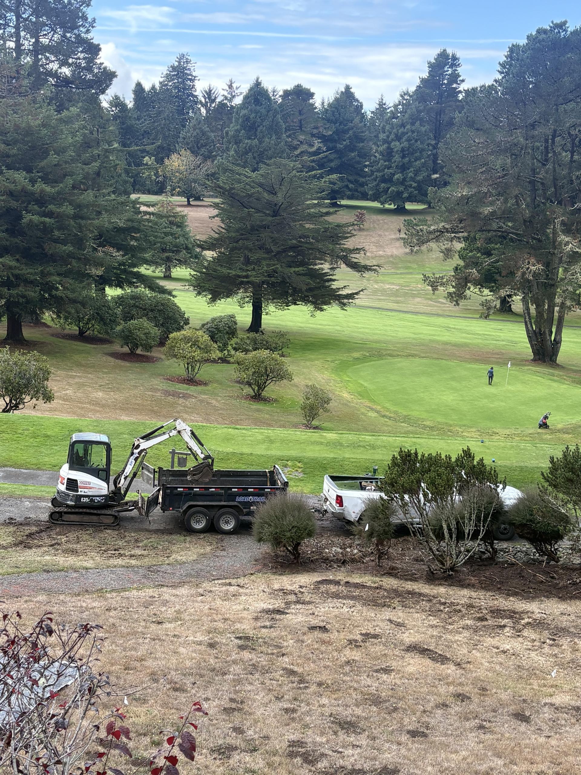 Junk removal team loading debris in Redding, CA