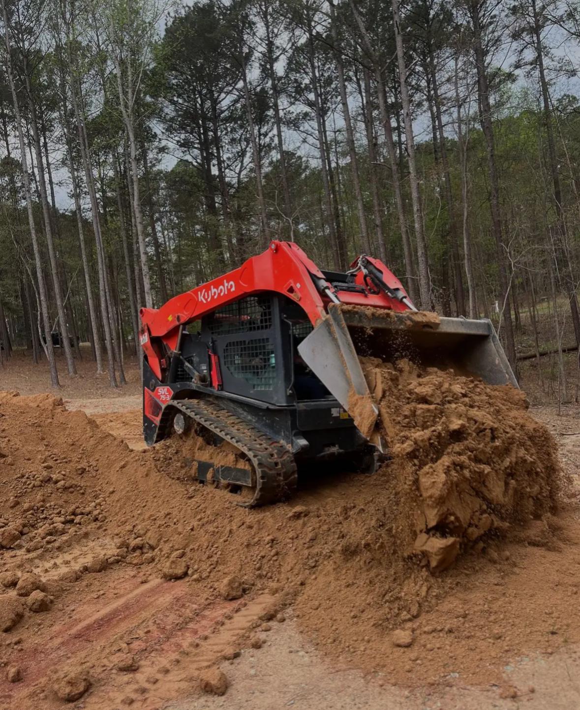 Brush and trees being removed from commercial lot